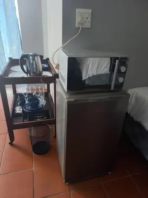 a microwave oven sitting on top of a stove at Beit-El BnB in Polokwane
