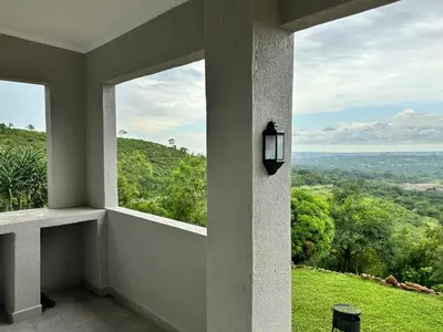 a room with a window with a view of a field at Hazyview Accommodation, Bon Repose Cottages 3&4 in Hazyview