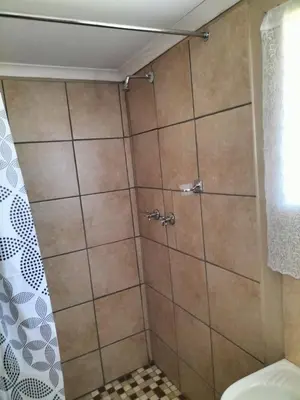 a shower in a bathroom with a shower curtain at BLESSINGS Sleep Over in Mokopane