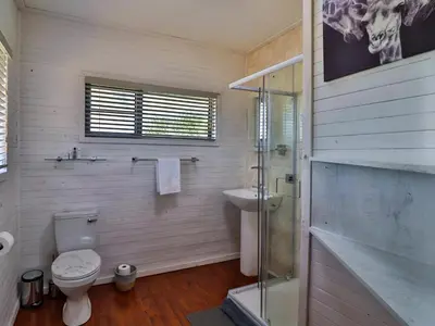 a bathroom with a toilet and a sink at Marloth Kruger View in Marloth Park