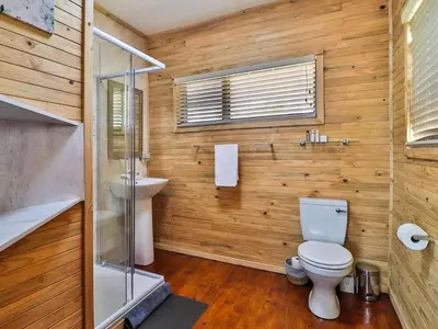 a bathroom with a toilet and a sink at Marloth Kruger View in Marloth Park