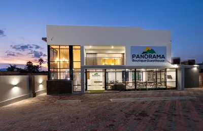 a building with a sign on the front of it at Panorama Boutique Guest House in Graskop