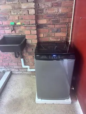 a trash can sitting next to a brick wall at Beevap Guesthouse in Pretoria
