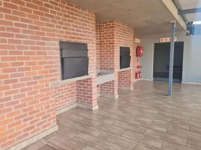 a brick wall with a fireplace in a building at Stunning City Living at Loftus in Pretoria