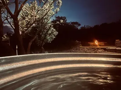 a close up of a fire hydrant on a road at night at Rocky Road Mountain Lodge in Pretoria