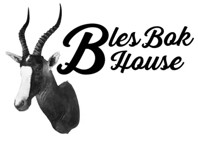 a black and white head of a reindeer with the words pies bat house at BlesBok House in Erasmus