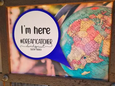 a map of the world with a sticker next to it at The Dreamcatcher Lodge in Hoedspruit
