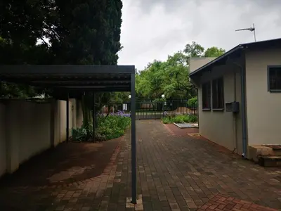 a brick driveway in front of a building at Cozy Manor Guestrooms in Lyttelton