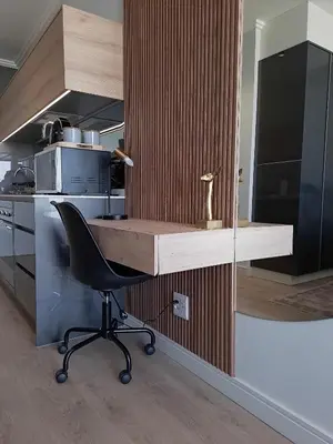 a kitchen with a desk and a chair in a room at Executive Apartment at Ellipse Waterfall in Midrand