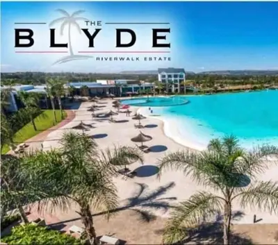 an image of a beach with chairs and palm trees at The Blyde resort in Pretoria