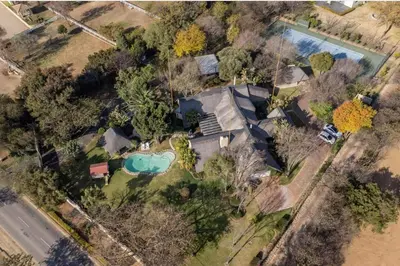 an overhead view of a house with a pool at Lipizzaner Lodge - Kyalami, Midrand in Kyalami