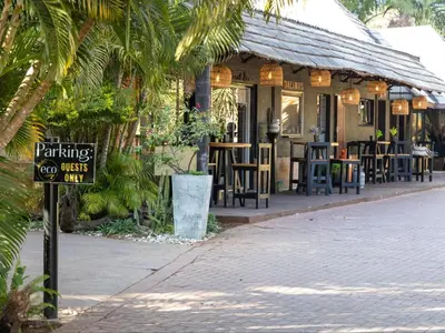a restaurant with a sign in front of it at Eco Lodge Lephalale in Lephalale