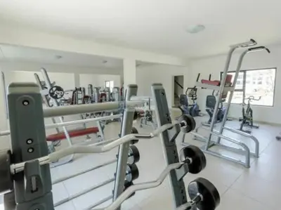 a gym with several tread machines in a room at Priceless 2Bed, Pool, Gym, Wifi in Midrand