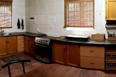 a kitchen with a stove and a counter top at Amani Milele (Everlasting Peace) in Marloth Park