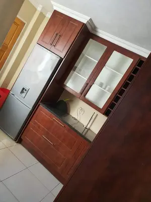 an overhead view of a kitchen with wooden cabinets at MAKWATAMBANI GUEST MANOR in Thohoyandou