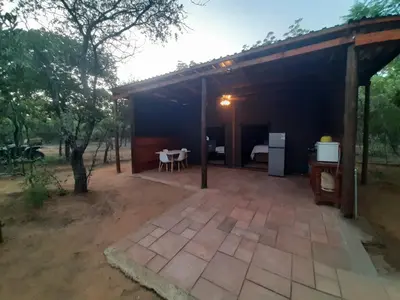 a pavilion with a table and chairs on a patio at VlakkiesKraal Bosbok Camp in Bela-Bela