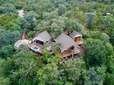 an aerial view of a house in the woods at Bushveld Bivouac Private Camp in Mica