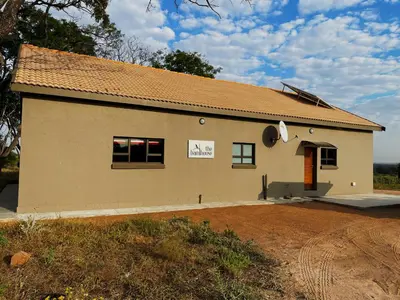 a building with a sign on the side of it at The Barnhouse in Hammanskraal