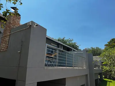 an external view of a house with a balcony at Moya-Sky in Komatipoort