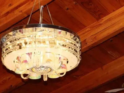a large glass chandelier hanging from a ceiling at Tee Cee Marvelous Guesthouse in Thabazimbi