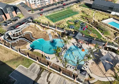 an overhead view of a pool at a resort at Neat Appartment, Fourways in Midrand