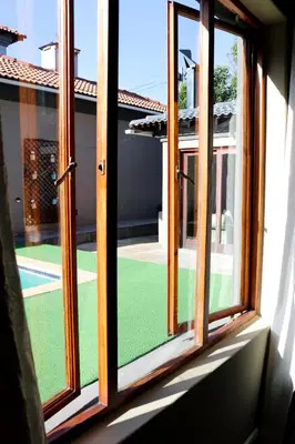 an open window with a view of a yard at Modern Home in Pretoria near Menlyn Mall in Pretoria