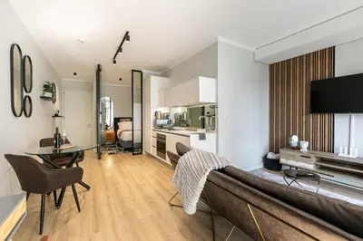 a living room with a couch and a table at Basia @Ellipse Waterfall in Midrand