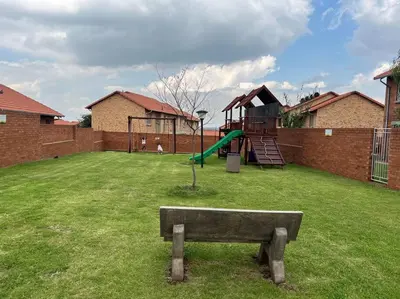 a park with a playground with a slide at Centurion: Chilled Townhouse in Centurion