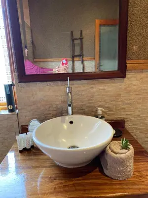a white sink in a bathroom with a mirror at Luna Crescente 19 and 19A Zebula golf and spa resort 14 Pax Bela Bela Limpopo in Mabula