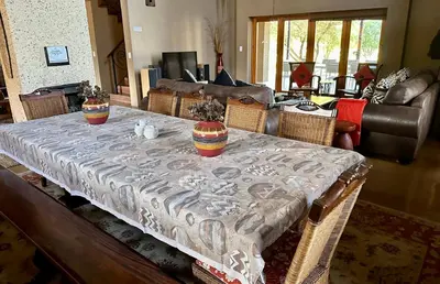 a table with a table cloth on it in a living room at Luna Crescente 19 and 19A Zebula golf and spa resort 14 Pax Bela Bela Limpopo in Mabula