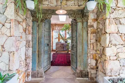 a stone hallway with a stone wall at Luxurious Hideaway Villa in Midrand