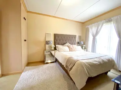 a bedroom with a large bed and a window at Siena Sun Luxury Suites in Erand