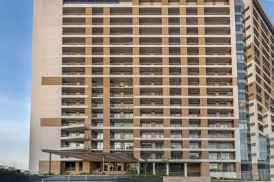 a tall building with a lot of windows at Menlyn Maine - The Trilogy Apartment 1111 in Pretoria