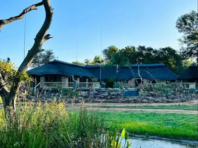 a house with a blue tarp on top of it at Sambane Game Lodge in Bracondale