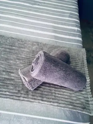 a bed with a towel on top of it at Ha-Dzibs backpackers accommodation in Thohoyandou