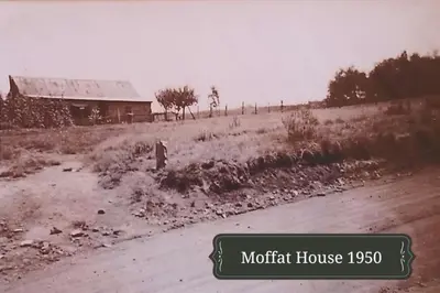 an old photo of a house and a dirt road at Lisbon Eco Lodge in Graskop