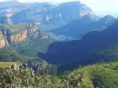 a view of a mountain valley with a river in it at Lisbon Eco Lodge in Graskop
