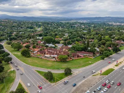 an aerial view of a city with a highway at Dew Drop Inn in Nelspruit
