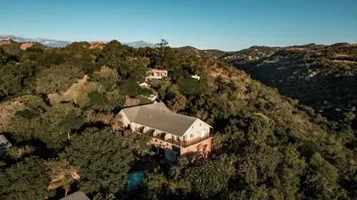 an aerial view of a house in the forest at The Green Lizard Guesthouse in Nelspruit