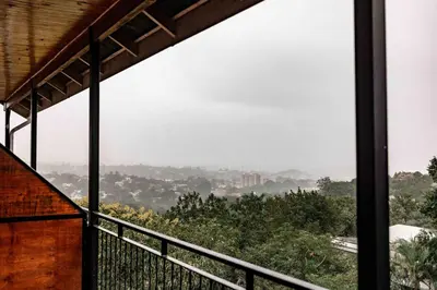 a view from the balcony of a house at The Green Lizard Guesthouse in Nelspruit