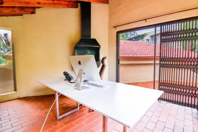 a white desk with a laptop on top of it at Brooklyn's Holiday Home in Pretoria