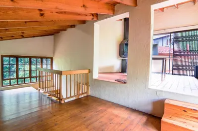 an empty room with a staircase and a window at Brooklyn's Holiday Home in Pretoria