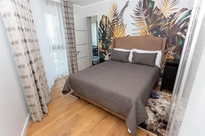 a bedroom with a bed in a room at Upmarket Executive Luxury Apartment in Midrand