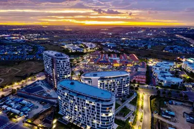 an aerial view of a city at night at Upmarket Executive Luxury Apartment in Midrand