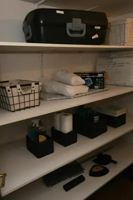 a shelf with items on it in a closet at Tranquil Garden Nest in Nelspruit