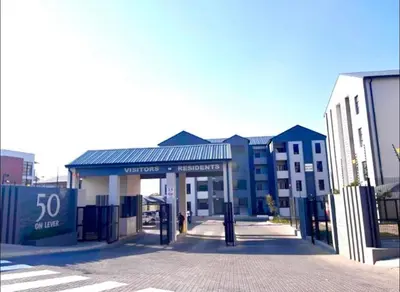 a gas station on a city street with buildings at Mellow-Suites Apartments - 31 - WIFI and Netflix in Midrand