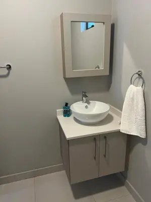 a bathroom with a sink and a mirror at Mellow-Suites Apartments - 31 - WIFI and Netflix in Midrand