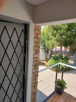 an open door to a patio with a plant at Stay@603 Guesthouse in Pretoria