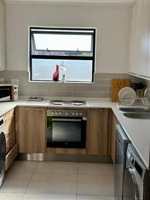 a kitchen with a stove and a window at M Luxury Home In Irene Centurion-No Blackouts in Centurion