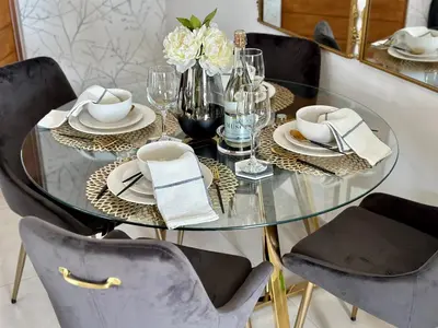 a dining room table with chairs and a glass table with flowers at M Luxury Home In Irene Centurion-No Blackouts in Centurion